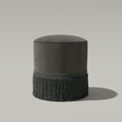     luxury ottoman upholstered in ebony gold feather pattern fabric with textured linear detailing