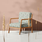 Fennel Feuille fire retardant velvet upholstery fabric shown on a classic chair