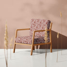 Oxblood Feuille Crib 5 velvet fabric upholstered on a statement chair
