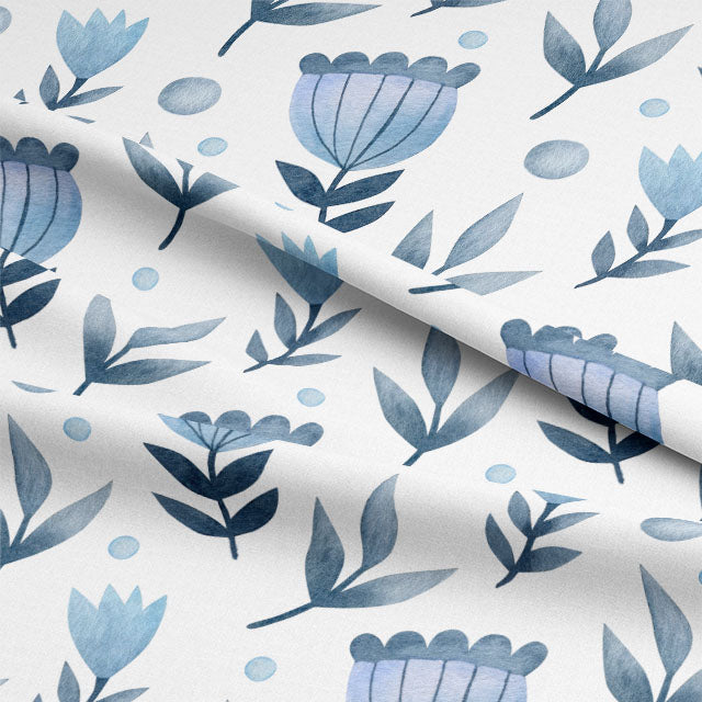 Close-up of blue cotton curtain fabric with folk stem pattern