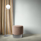 Fremont Apricot striped curtain fabric styled as full-length curtains in a modern room.