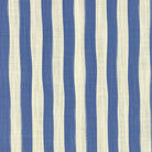 Flat lay image of Fremont Blue striped curtain fabric in classic navy and soft natural tones.