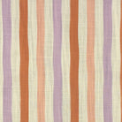 Flat lay image of Fremont Lavender striped curtain fabric with mauve, peach, and taupe tones.