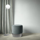 Fremont Mist striped curtain fabric styled as curtains in a soft-toned, minimal space.
