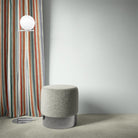 Fremont Multi striped curtain fabric styled as curtains in a vibrant modern room.