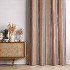 Fresno Stripe Sorbet linen curtain fabric used as curtains with lilac, blush, and rust tones for a playful, eclectic interior scheme