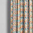 Gisburn washable leaf fabric shown as full-length curtains in a colourful botanical room setting