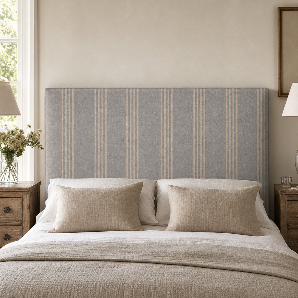 Hampton Blue striped upholstery fabric shown on a headboard, durable 35,000 Martindale fabric for bedroom upholstery and soft furnishings