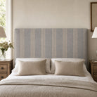 Hampton Blue striped upholstery fabric shown on a headboard, durable 35,000 Martindale fabric for bedroom upholstery and soft furnishings