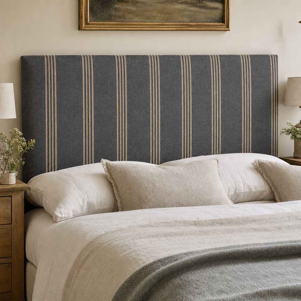 Hampton Charcoal striped upholstery fabric on a headboard, fire retardant option available for tailored bedroom upholstery