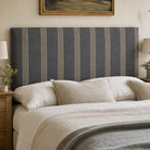 Hampton Charcoal striped upholstery fabric on a headboard, fire retardant option available for tailored bedroom upholstery