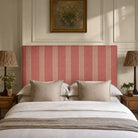 Hampton Red striped upholstery fabric on a headboard, durable heavy duty fabric for bold bedroom upholstery and interiors