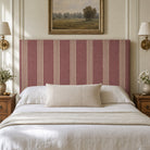Hampton Wine striped upholstery fabric displayed on a headboard, classic stripe for durable bedroom upholstery and soft furnishings