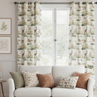 Wildlife-themed hare curtain fabric in a light-filled living room, styled with a white sofa and earthy-toned cushions