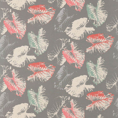 Harlequin Palmetto curtain fabric in Coral/Mint with a tropical leaf print.