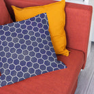 Navy honeycomb fabric cushion styled with a modern blue geometric pattern