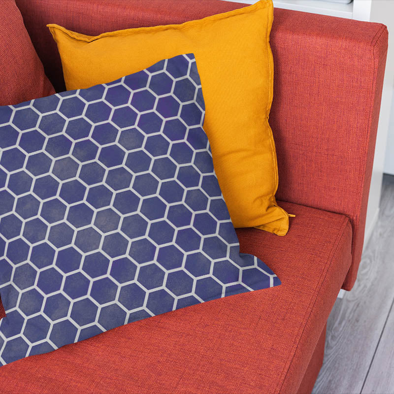 Navy honeycomb fabric cushion styled with a modern blue geometric pattern