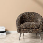 Indian leopard print fabric on chair for maximalist interiors