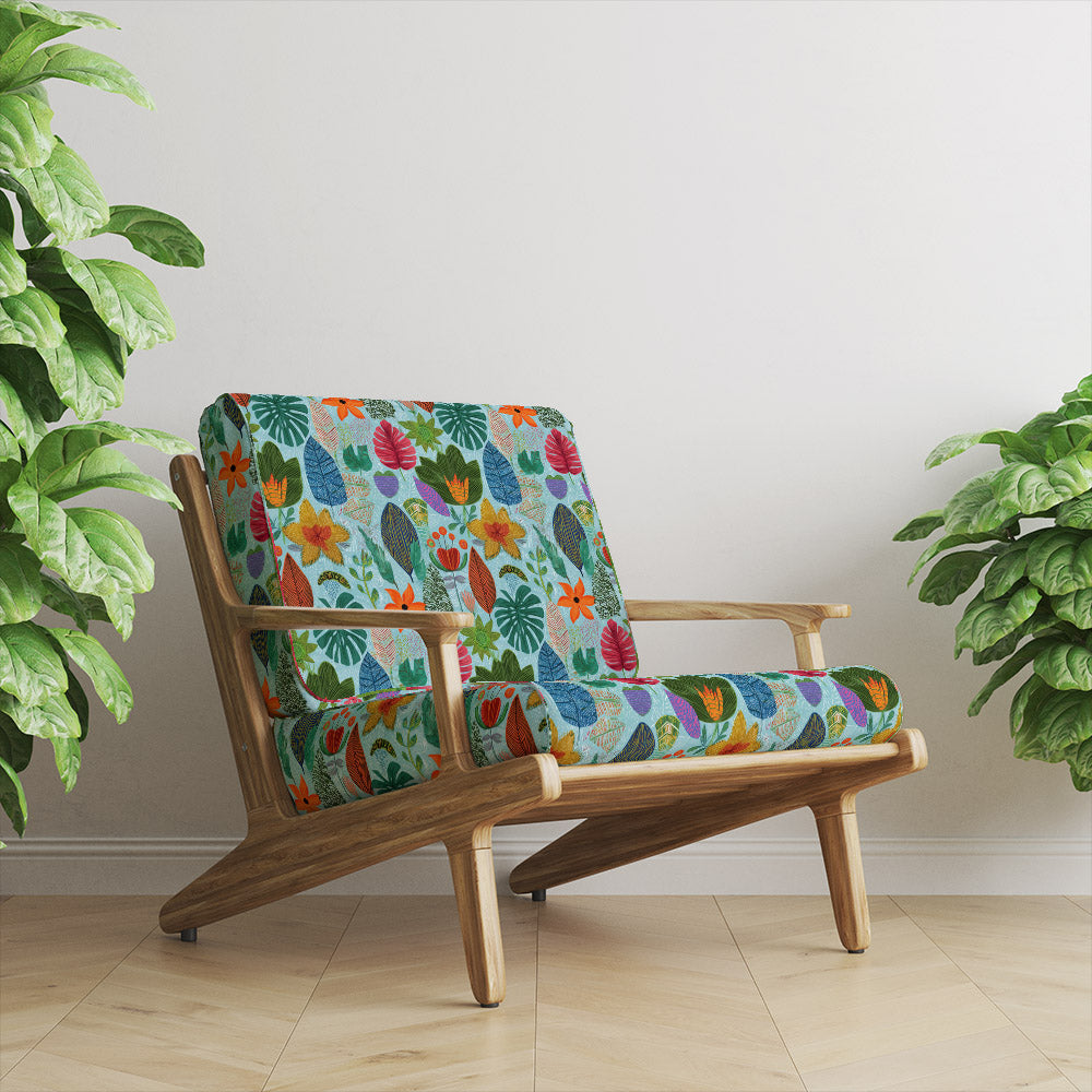 Isla velvet upholstery fabric on wooden chair displaying vibrant floral velvet pattern with rich colour depth