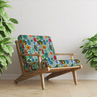 Isla velvet upholstery fabric on wooden chair displaying vibrant floral velvet pattern with rich colour depth