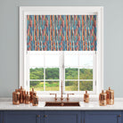 colourful striped curtain fabric shown as roman blind with painterly vertical stripe design in kitchen setting