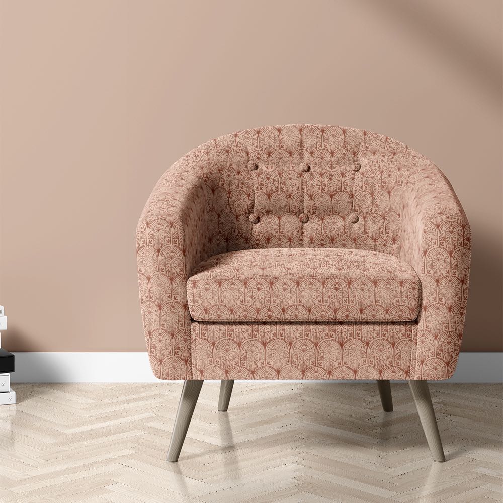 Armchair upholstered in Kadapa Geometric Velvet Fabric with rich terracotta tones and a repeating arched pattern, ideal for velvet upholstery fabric use.