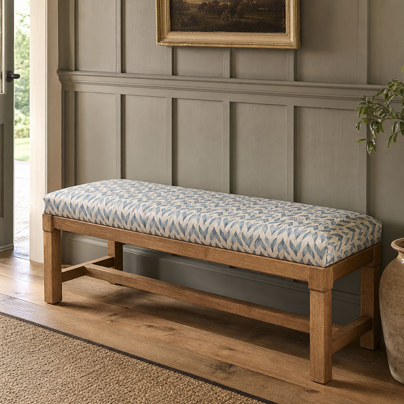 Kenitra Aegean geometric upholstery fabric shown on a bench, blue patterned fabric for upholstery and blinds