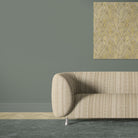 Khenifra Natural velvet upholstery fabric shown on a sofa with vertical geometric stripe design