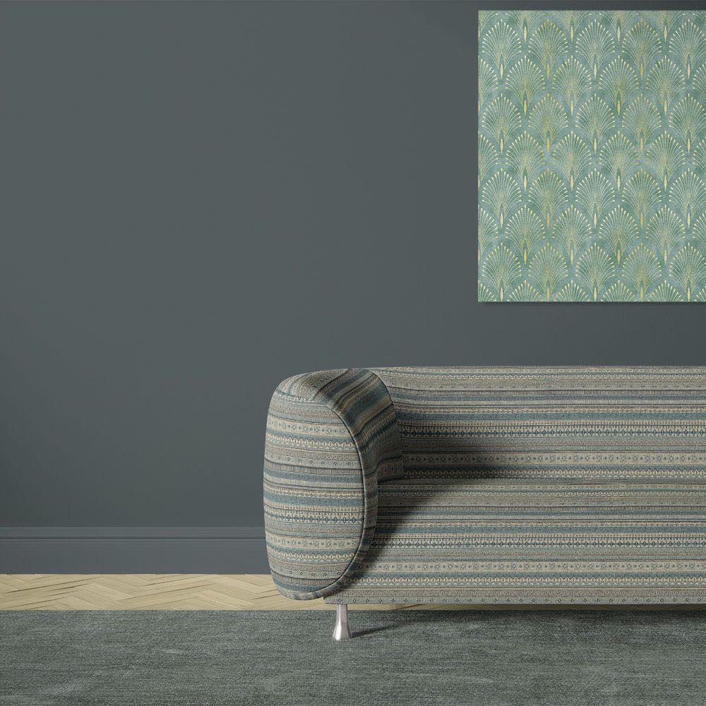 Khenifra Teal railroaded velvet upholstery fabric shown on a sofa with horizontal kilim stripe layout