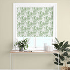 green japanese curtain fabric roman blind displaying botanical toile pattern with trees and architectural elements in soft natural tones