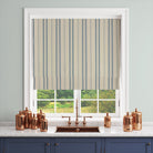 Lowick Stripe blue curtain fabric shown as a Roman blind in a bright interior