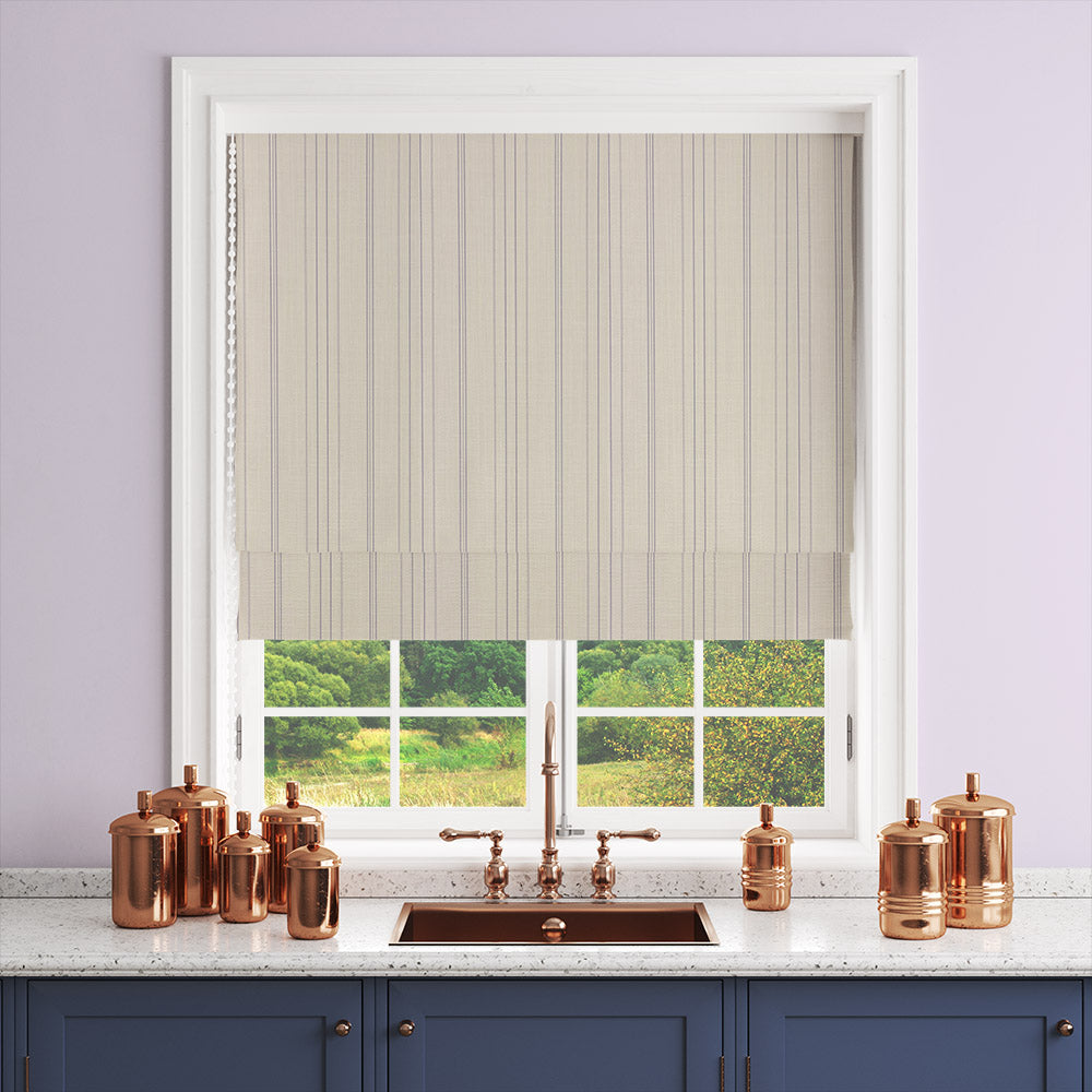 Lowick Stripe lilac curtain fabric shown on a Roman blind in a neutral room