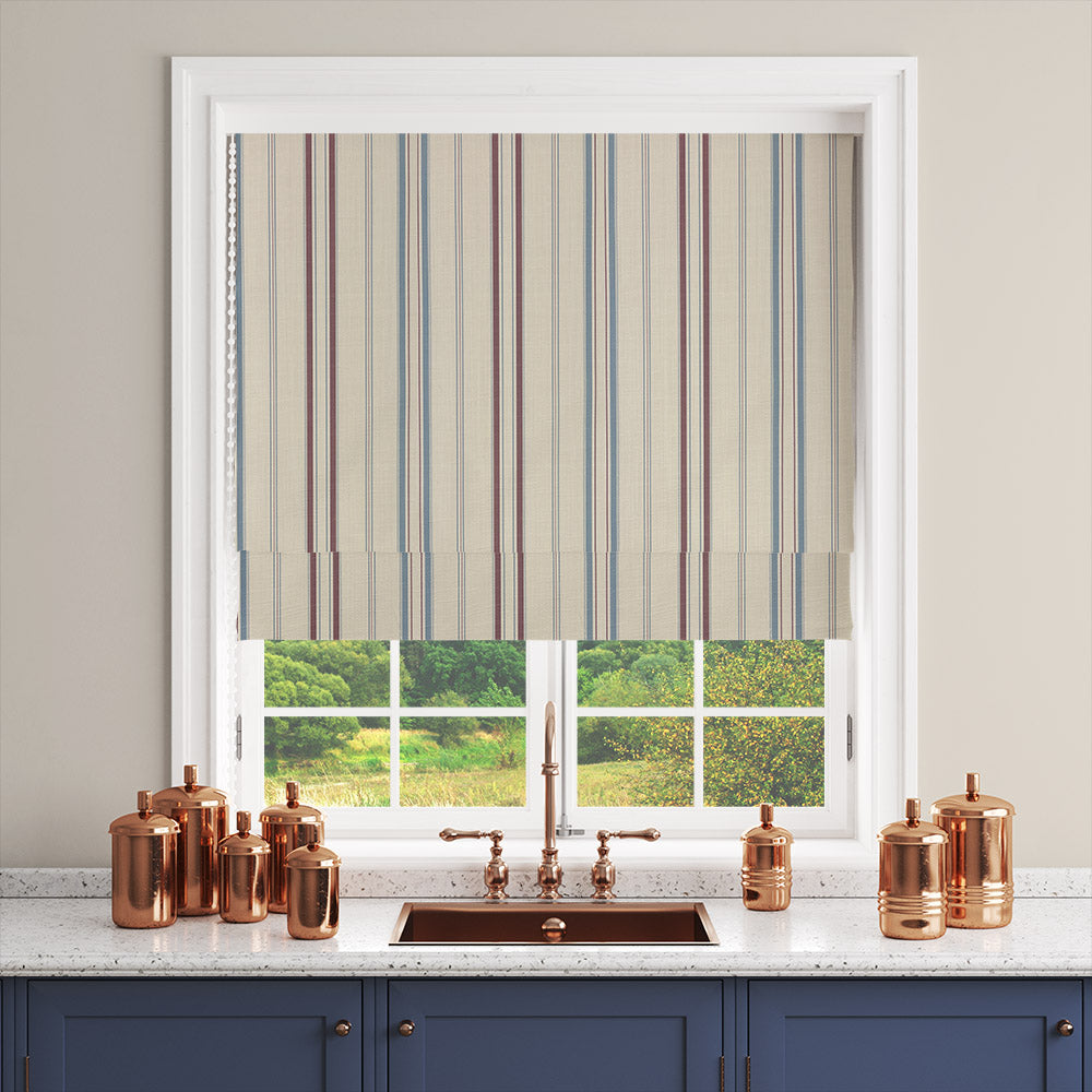 Lowick Stripe red blue striped curtain fabric shown as a Roman blind