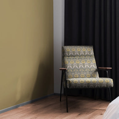 Mackintosh Ochre Upholstery Fabric – chair upholstered in ochre and green geometric floral fabric with classic Mackintosh design