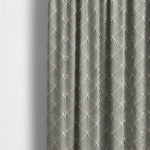     art deco patterned curtain fabric in neutral and gold tones hanging as elegant drapes