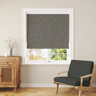 Milly Dark Sage Roman blind in room setting showing floral linen curtain fabric