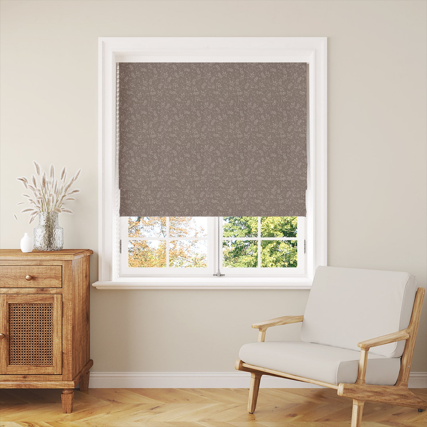 Milly Natural Roman blind in room setting with neutral floral linen curtain fabric
