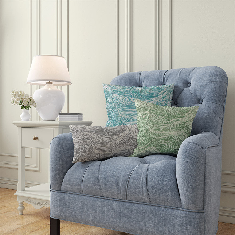 Newquay Blue wave pattern curtain fabric styled as cushion – coastal cotton curtain fabric in flowing wave design