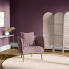 Accent chair in Newton purple geometric upholstery fabric with hexagon pattern in a plum-coloured room