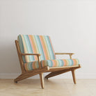 Ohio Stripe Multi Velvet Upholstery Fabric room set showing multicoloured striped velvet on contemporary wooden sofa