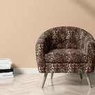 Persian leopard print fabric on chair in a decorative room setting