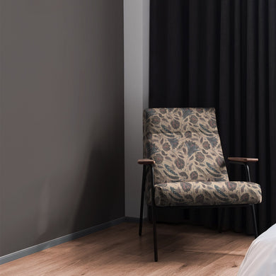 Chair upholstered in Porthgain Natural floral upholstery fabric in a classic style