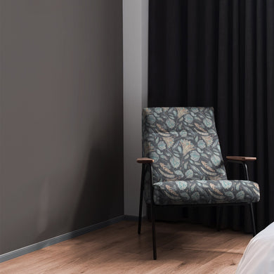 Armchair styled in Porthgain Navy floral upholstery fabric with bold pattern