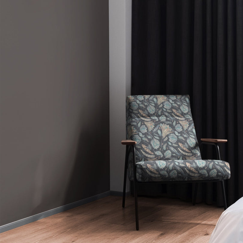 Armchair styled in Porthgain Navy floral upholstery fabric with bold pattern