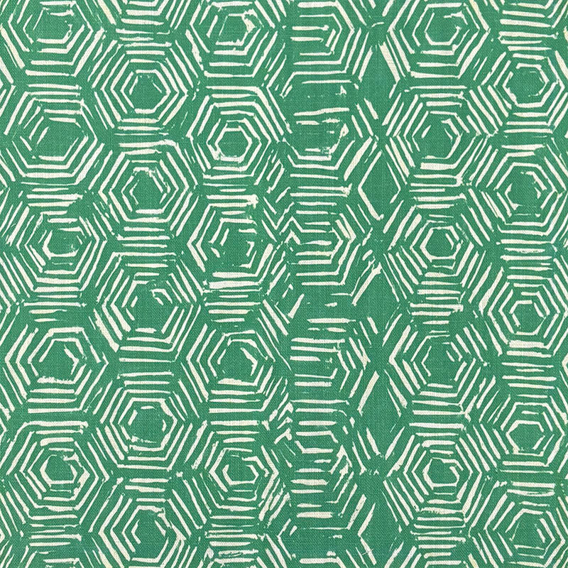 Flat image of green linen curtain fabric with white geometric design