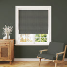 Rowan Leaf Hunter linen Roman blind with an Arts and Crafts green tree pattern in a traditional room