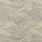 Grey wave style upholstery fabric flat lay with organic flowing pattern detail