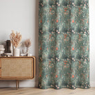 Savanna Emerald Velvet Fabric – green velvet curtain fabric with floral design, hanging in interior