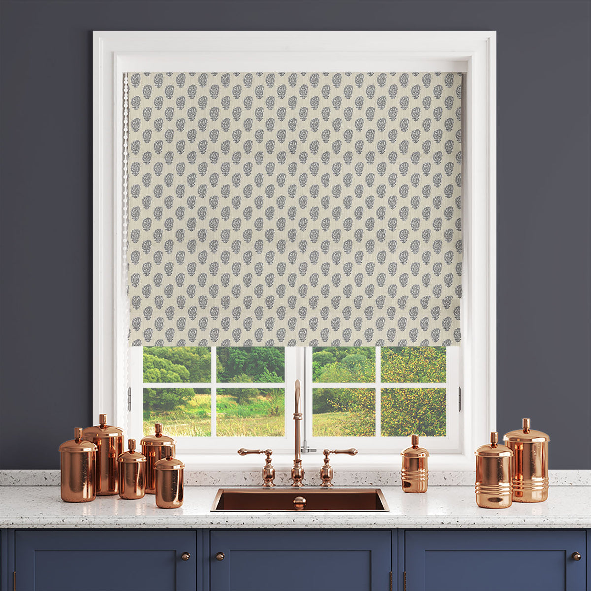 Navy blue paisley curtain fabric styled as a Roman blind in a traditional interior