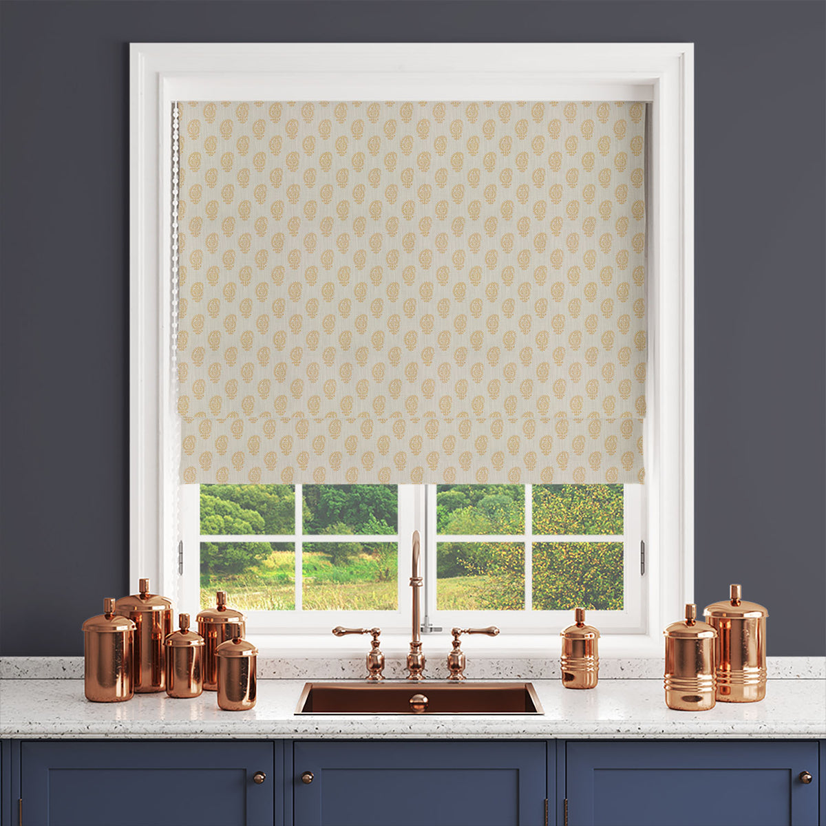 Ochre paisley curtain fabric styled as a Roman blind with warm yellow tones